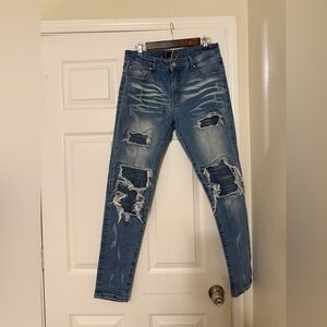 Amiri Distressed Knee Patched Jeans